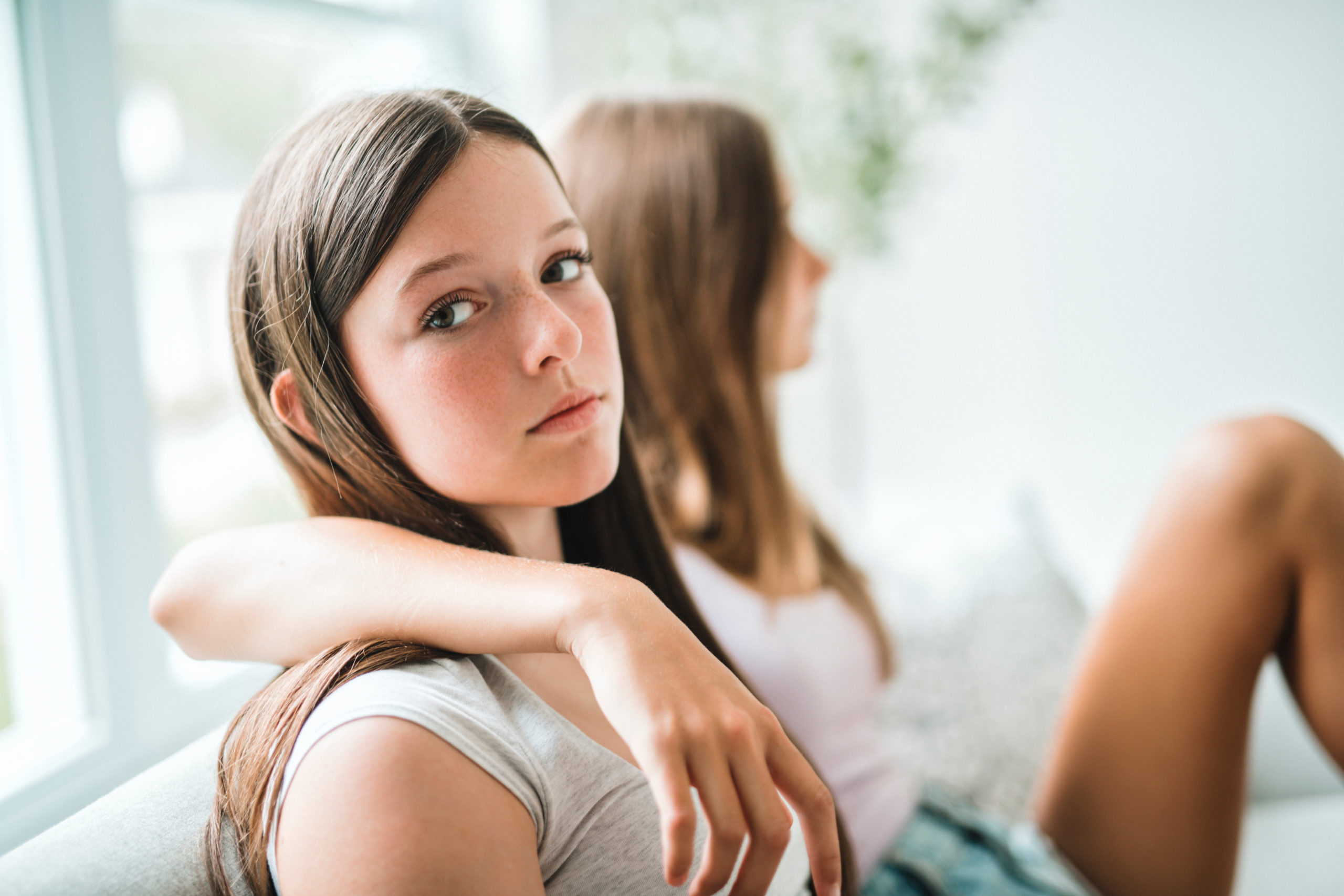 Two friends with one not speaking to the other